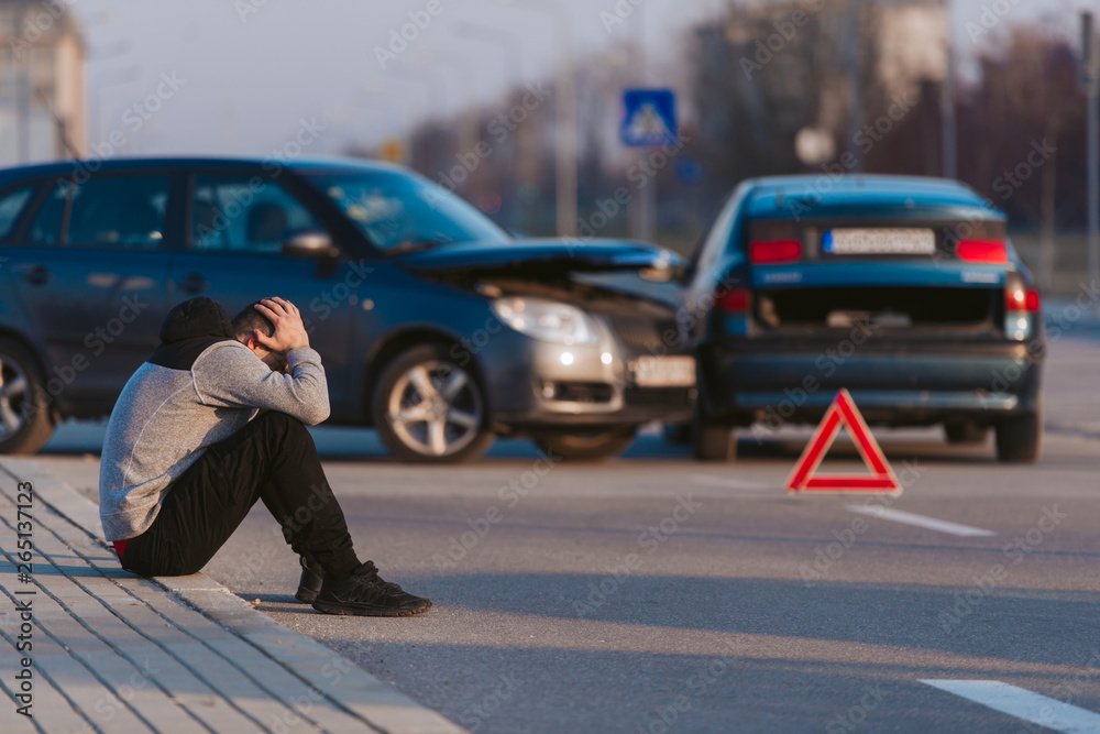 Sad man after car accident